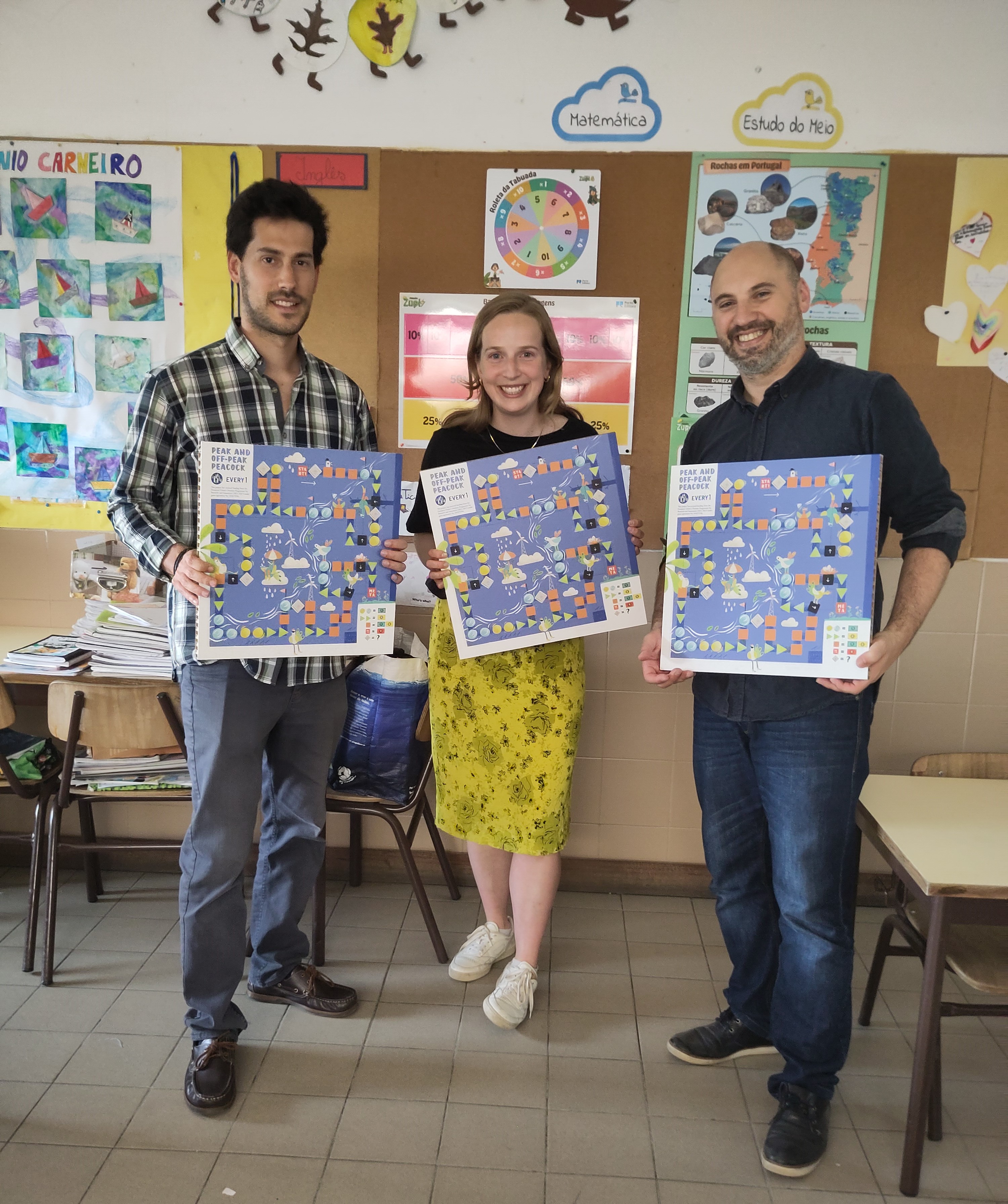 People showcasing the EVERY1 board game